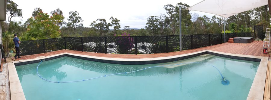 Palmy Perf design pool fencing in Textured Black beside a Gold Coast pool