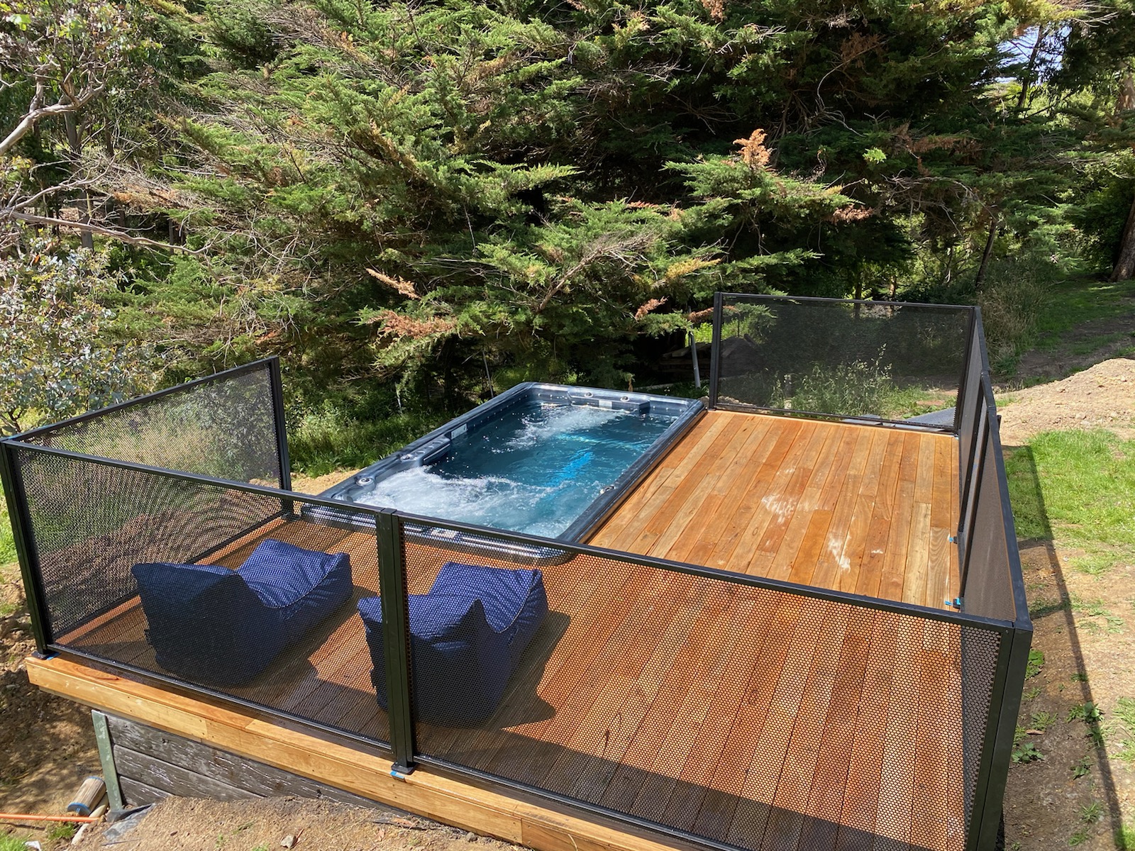 Pure Perf black fencing around a spa, Victoria
